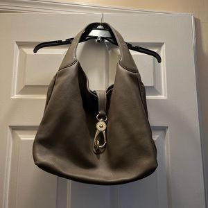 Dooney and Bourke lock shoulder bag in gray. Like new.